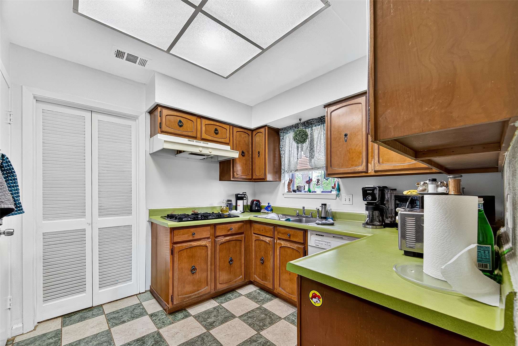 8222 La Roche Lane Houston, TX 77036 - Photo 9 of 32 a kitchen with a sink a counter space cabinets and stainless steel appliances
