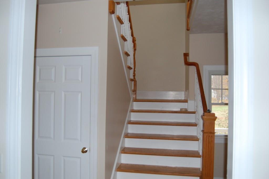 236 Hardwick Road New Braintree, MA 01531 - Photo 11 of 28 a view of staircase with wooden floor and white walls