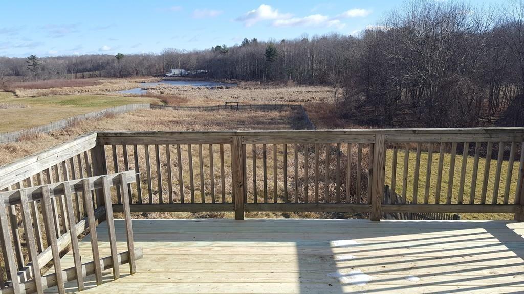 236 Hardwick Road New Braintree, MA 01531 - Photo 28 of 28 a view of a yard with wooden floor and fence