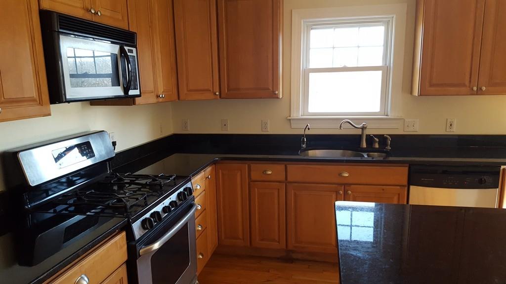 236 Hardwick Road New Braintree, MA 01531 - Photo 4 of 28 a kitchen with granite countertop stainless steel appliances a sink stove and cabinets