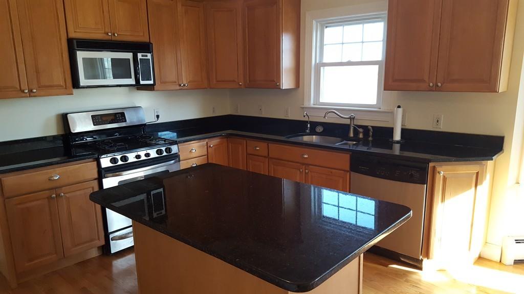 236 Hardwick Road New Braintree, MA 01531 - Photo 5 of 28 a kitchen with granite countertop a stove a sink and a window