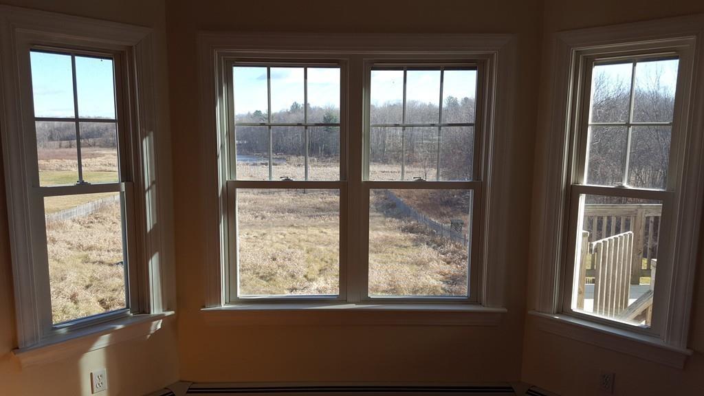 236 Hardwick Road New Braintree, MA 01531 - Photo 6 of 28 a view of an empty room and window