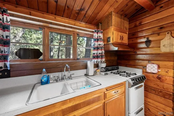 a kitchen that has a stove and a microwave
