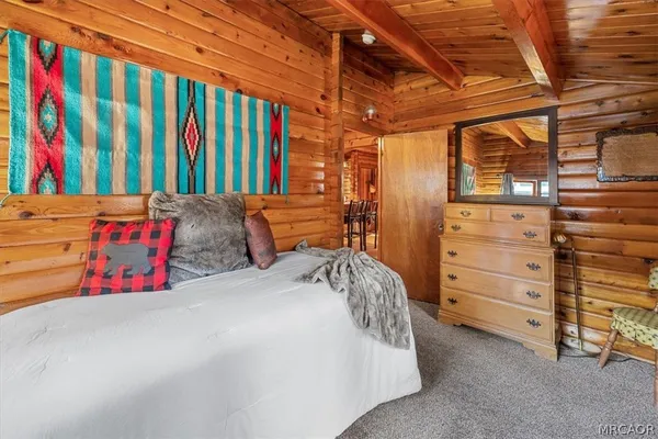 a bedroom with a bed and a closet