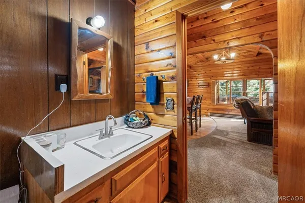 a bathroom with a sink and a mirror