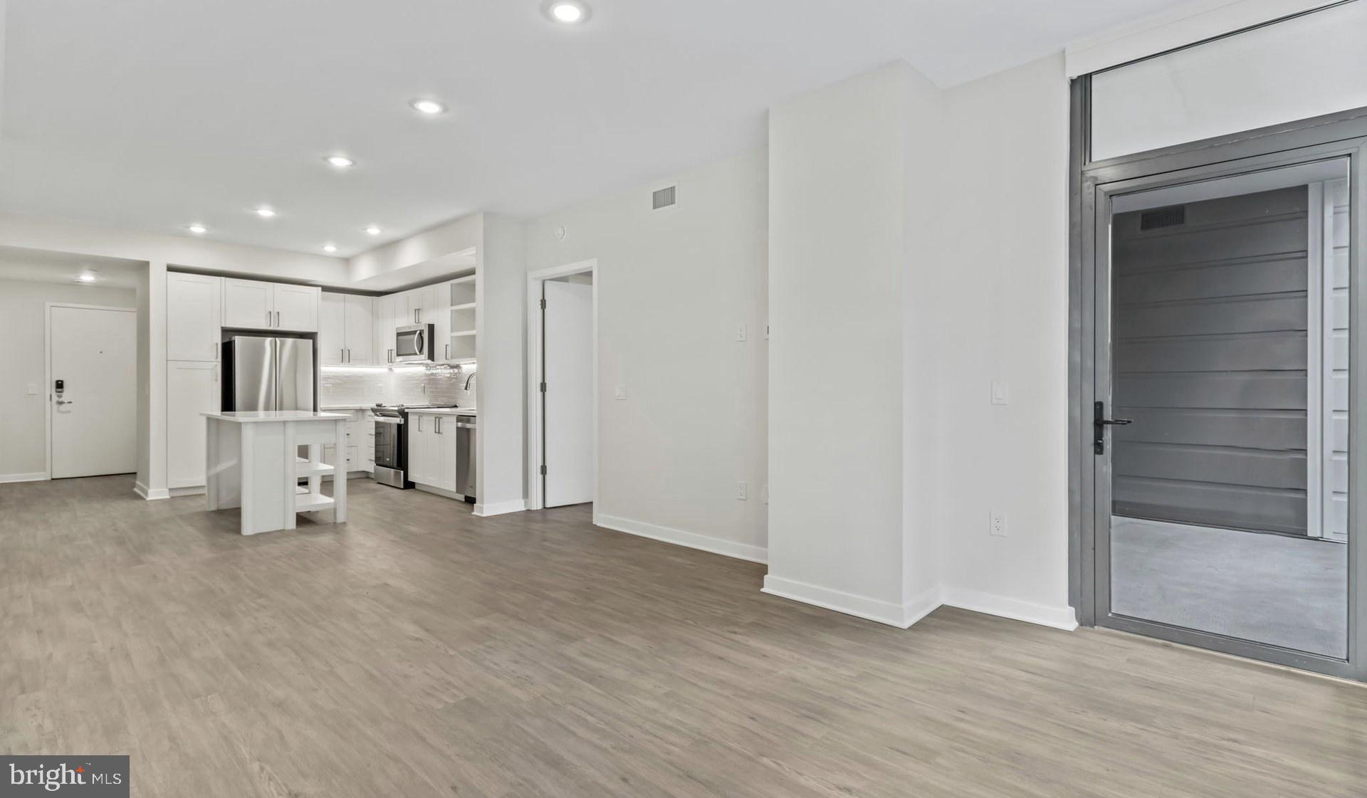 4000 Wisconsin Avenue Northwest, Unit 4K236 Washington, DC 20016 - Photo 21 of 54 a view of a livingroom with wooden floor