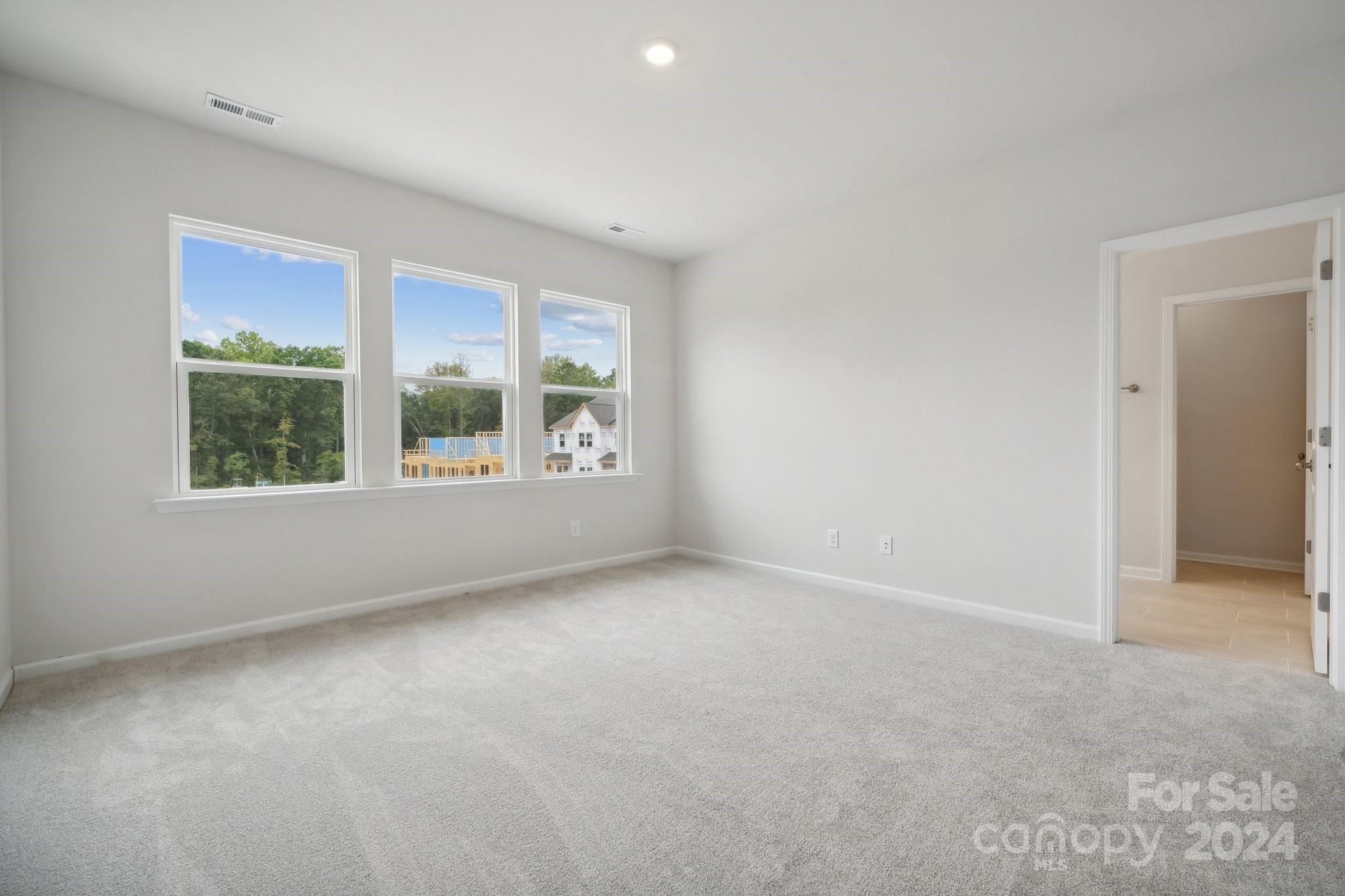 8606 Miles Gap Road Indian Land, SC 29707 - Photo 14 of 26 an empty room with windows