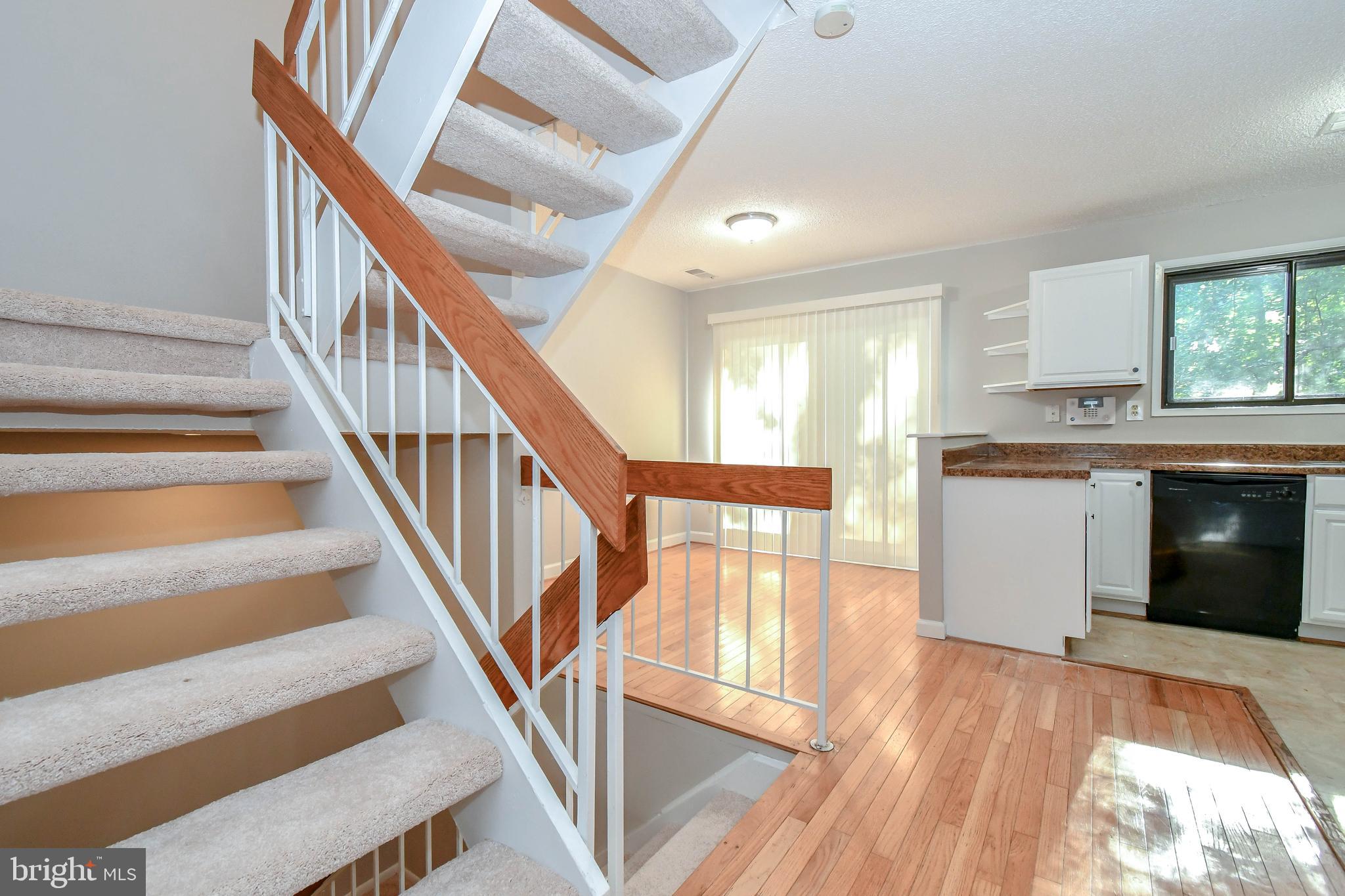 2218 White Cornus Lane Reston, VA 20191 - Photo 11 of 35 Stairs and kitchen