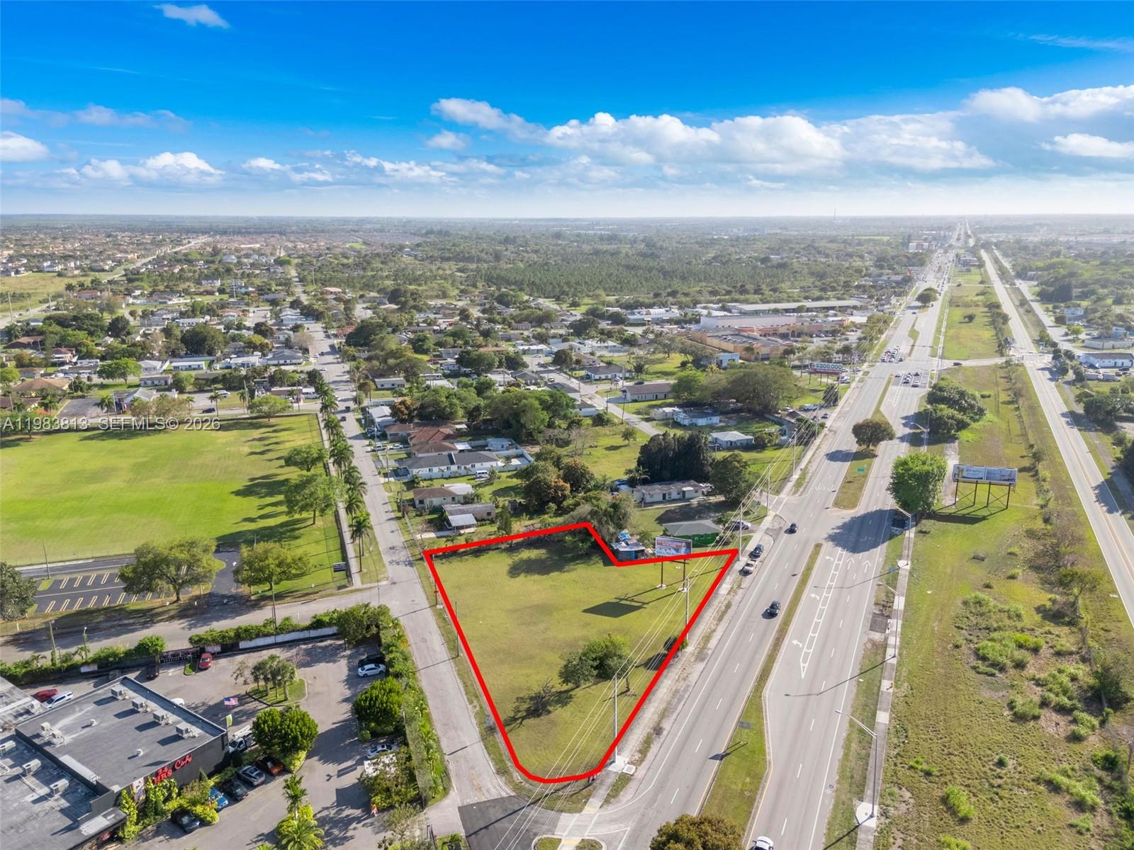 21710 Southwest 118th Avenue Miami, FL 33170 - Photo 5 of 24 an aerial view of residential houses with outdoor space