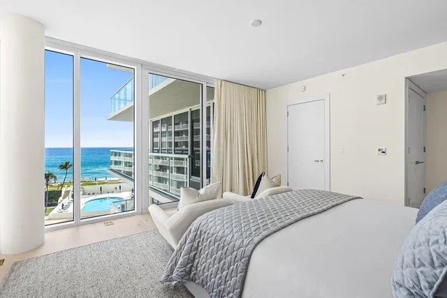 a bathroom with a double vanity sink a mirror and a bathtub