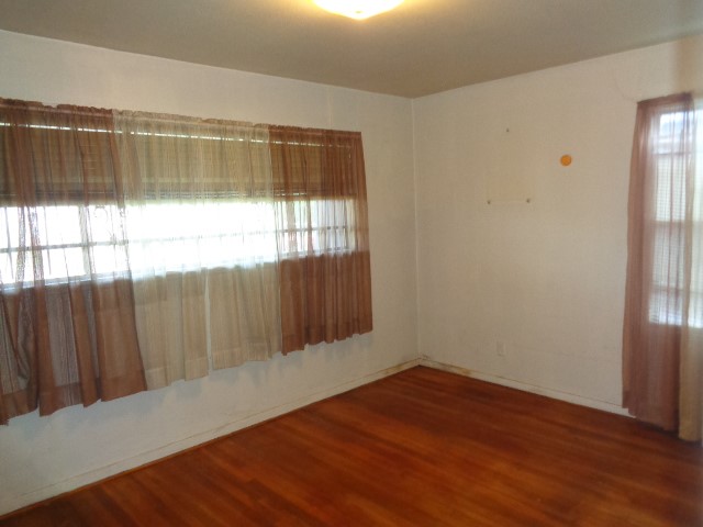 5614 Rue Street Houston, TX 77033 - Photo 12 of 18 a view of wooden floor and brick walls