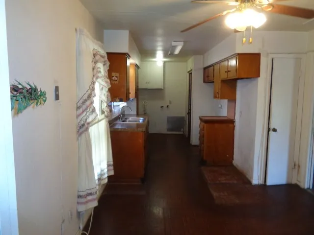 en empty room with windows and entrance