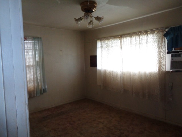 5614 Rue Street Houston, TX 77033 - Photo 15 of 18 en empty room with windows and entrance