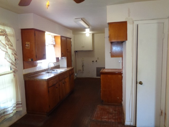 5614 Rue Street Houston, TX 77033 - Photo 3 of 18 a kitchen with stainless steel appliances granite countertop a sink and a refrigerator