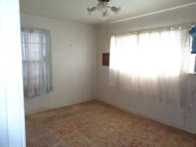 a view of a hallway with a chandelier