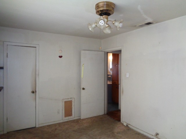 5614 Rue Street Houston, TX 77033 - Photo 9 of 18 a view of a hallway with a chandelier