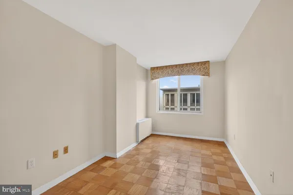 a view of an empty room with a window