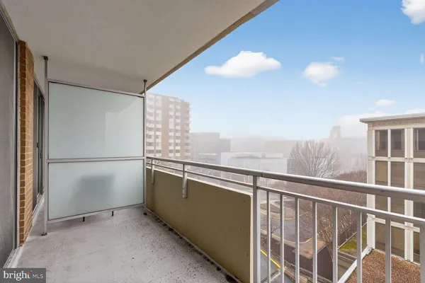 a view of a kitchen with furniture and a window