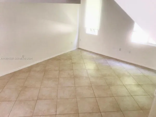 a view of an empty room and window