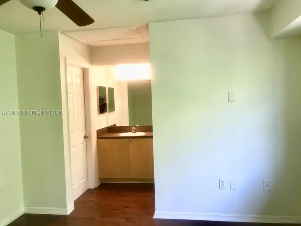 a view of a kitchen from the hallway
