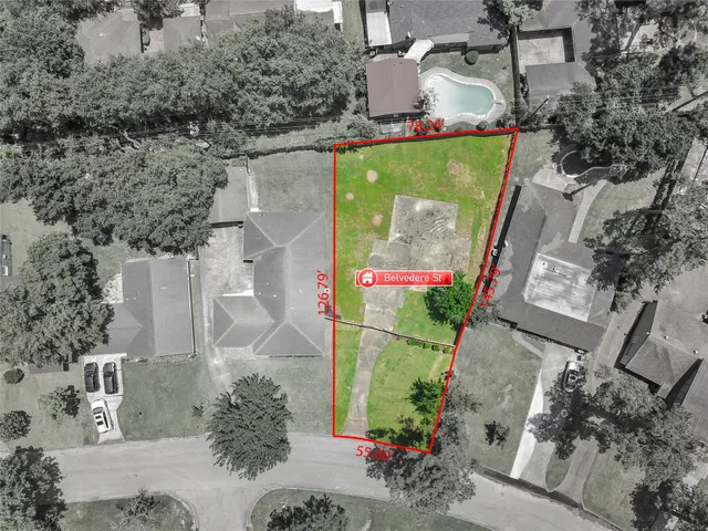 an aerial view of house with yard