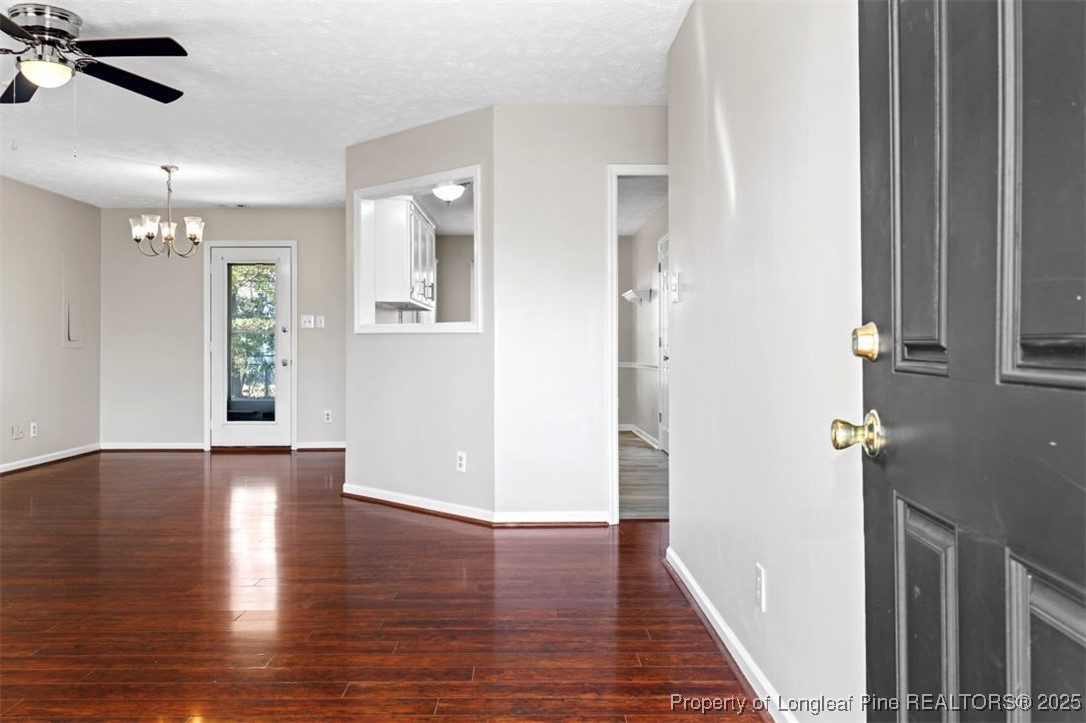 102 Ryans Circle Spring Lake, NC 28390 - Photo 9 of 26 an empty room with wooden floor and windows