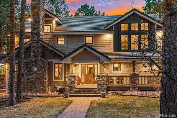 a front view of a house with large windows