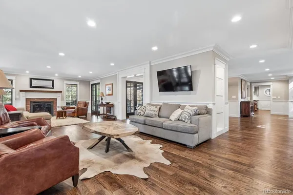 a living room with fireplace furniture and a flat screen tv