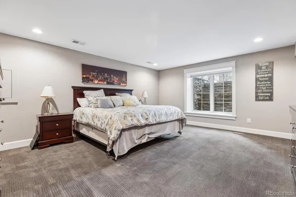 a bedroom with a bed and a cabinets