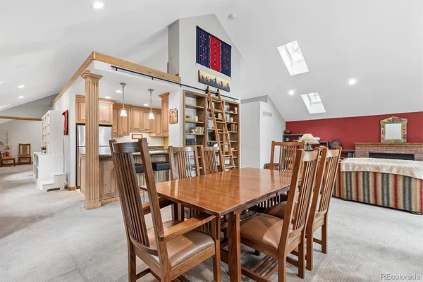 a view of a dining room and livingroom with furniture