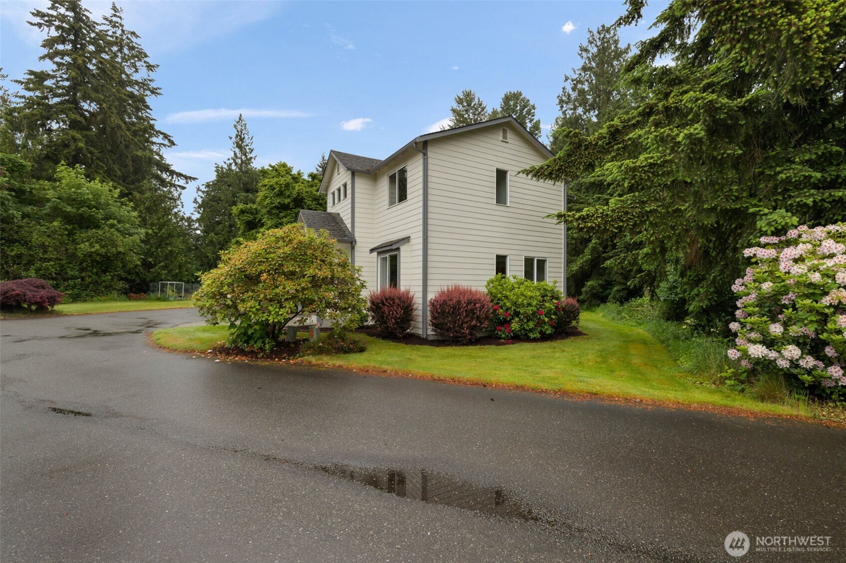 3560 Courtyard Lane Bremerton, WA 98310 - Photo 25 of 26 a view of a house with a street and a yard