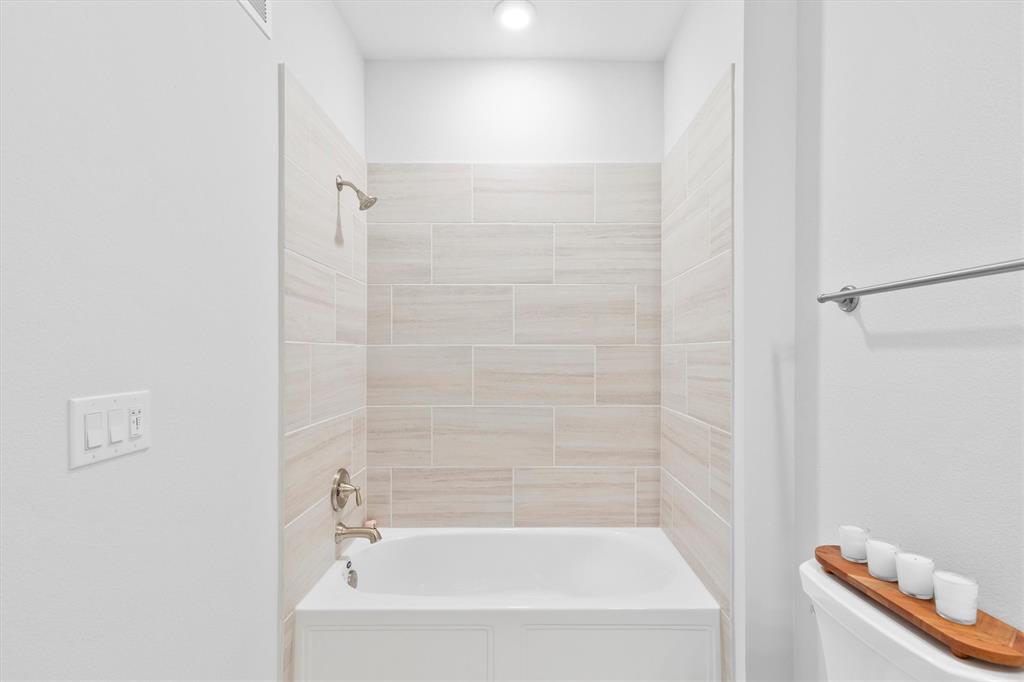 651 Watters Road, Unit 4403 Allen, TX 75013 - Photo 25 of 37 a bathroom with a bathtub