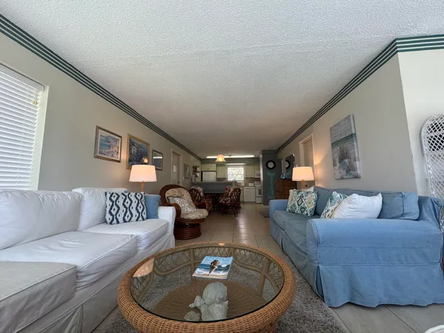 a kitchen with a sink appliances and cabinets