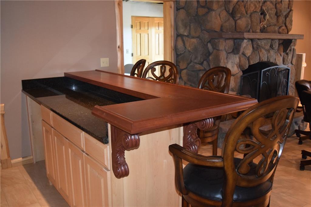 249 A Owlsboro Road Mount Chase, ME 04765 - Photo 20 of 35 Lower level bar area with granite...
