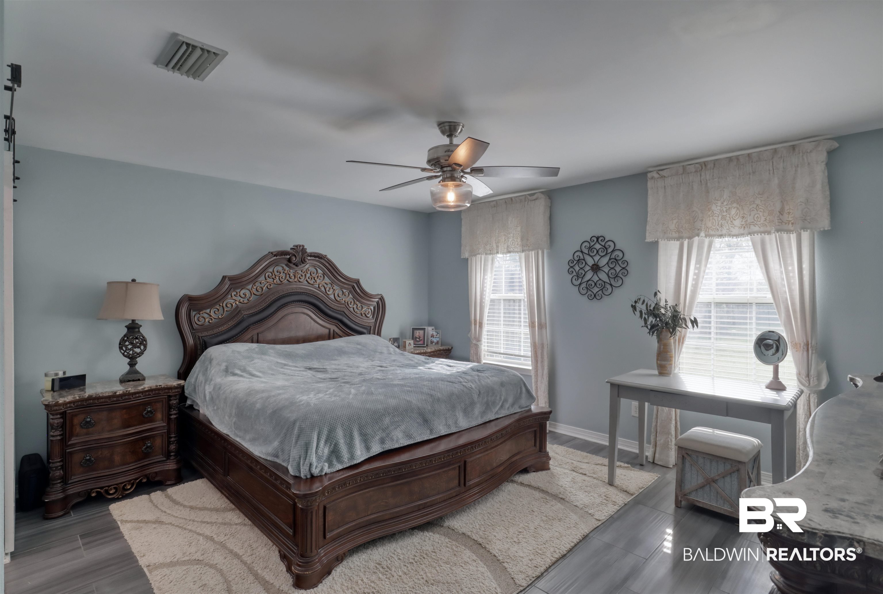 12893 Hunters Chase Foley, AL 36535 - Photo 23 of 42 Bedroom featuring baseboards, ceiling fan, visible vents, and wood finished floors