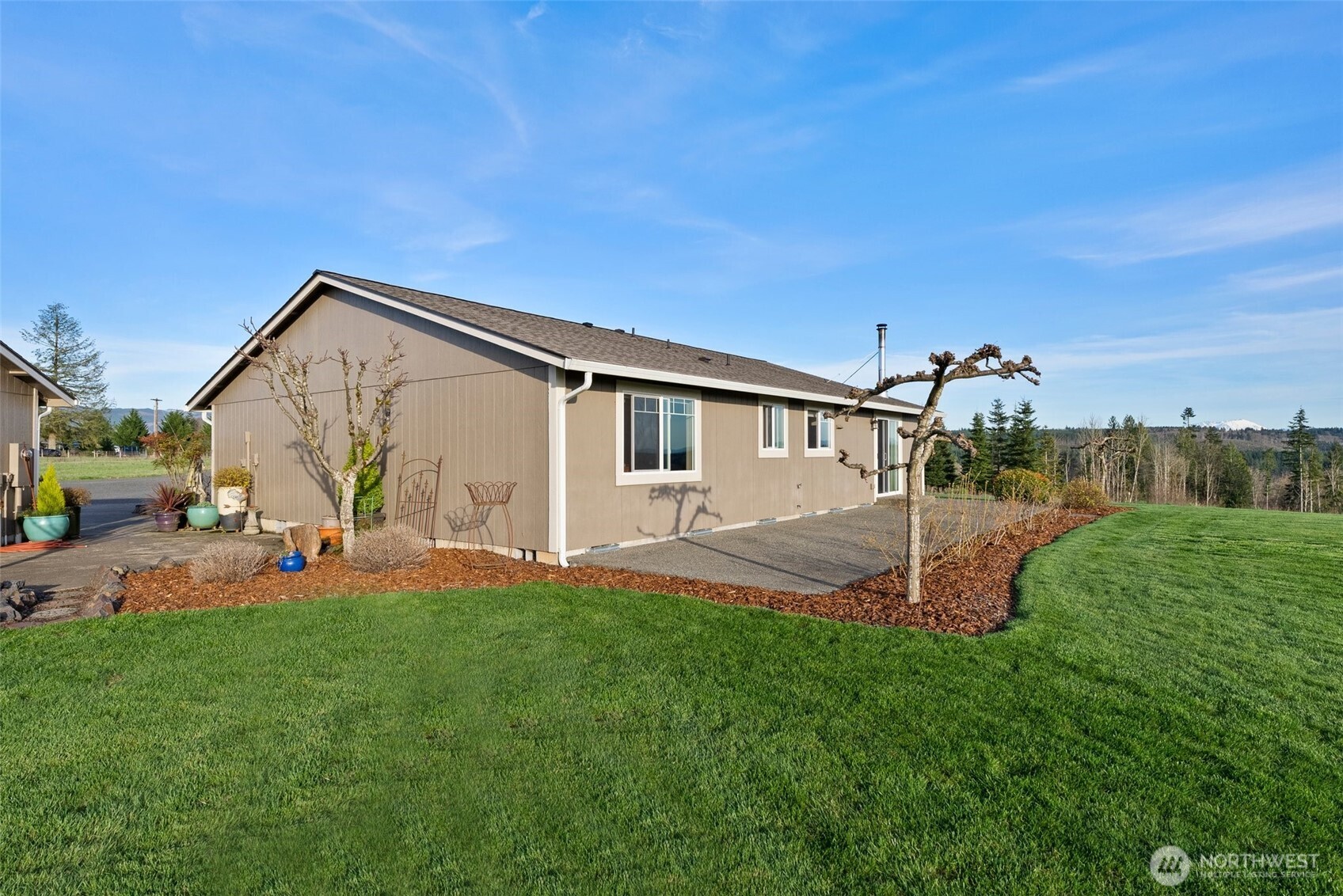 198 Short Road Onalaska, WA 98570 - Photo 30 of 40 a front view of a house with a yard and garage
