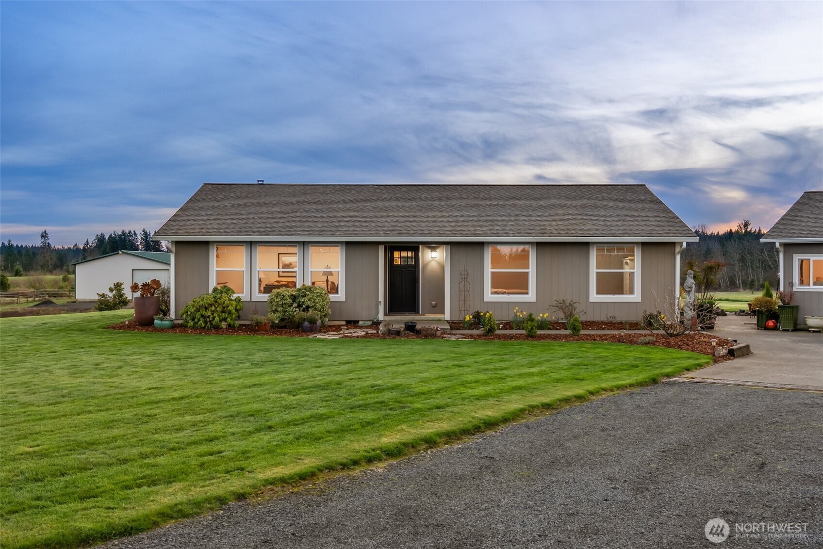 198 Short Road Onalaska, WA 98570 - Photo 6 of 40 a front view of a house with a garden and porch