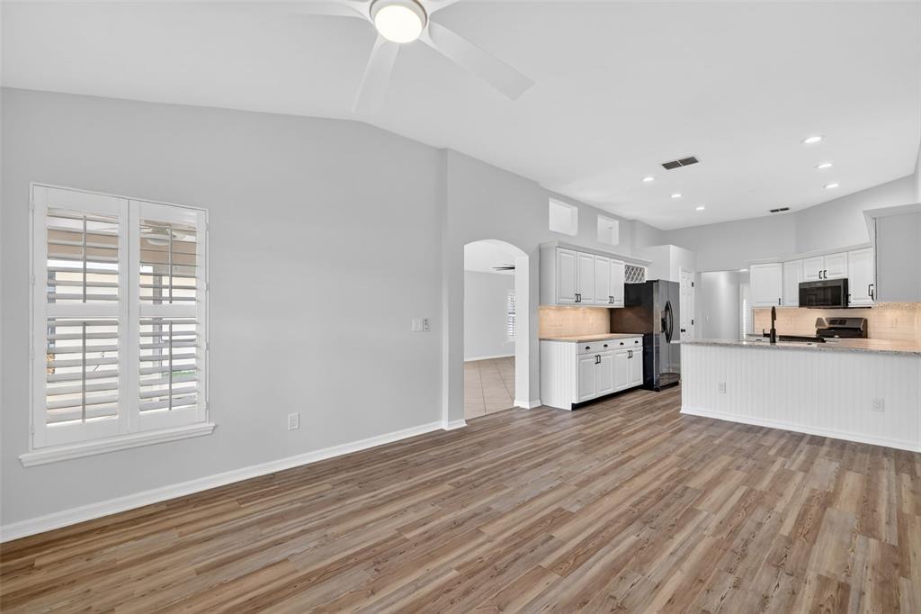 6027 Spring Creek Court Mount Dora, FL 32757 - Photo 11 of 42 a view of a kitchen with a sink a refrigerator and window
