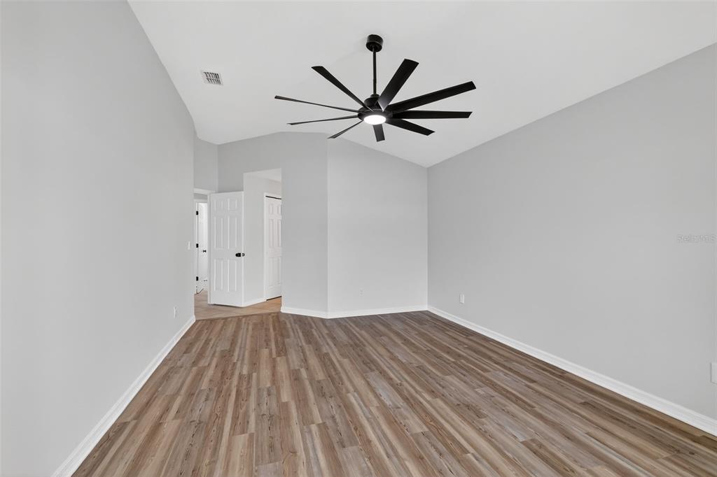 6027 Spring Creek Court Mount Dora, FL 32757 - Photo 19 of 42 wooden floor in a empty room