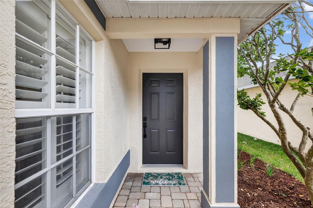 6027 Spring Creek Court Mount Dora, FL 32757 - Photo 3 of 42 a view of front door of house and stairs