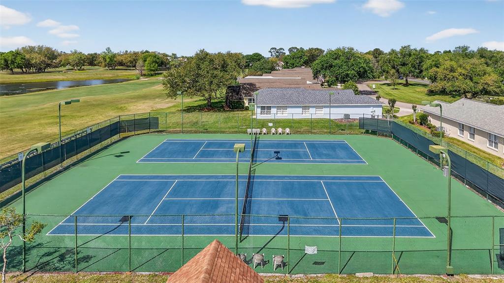 6027 Spring Creek Court Mount Dora, FL 32757 - Photo 38 of 42 a view of a tennis court