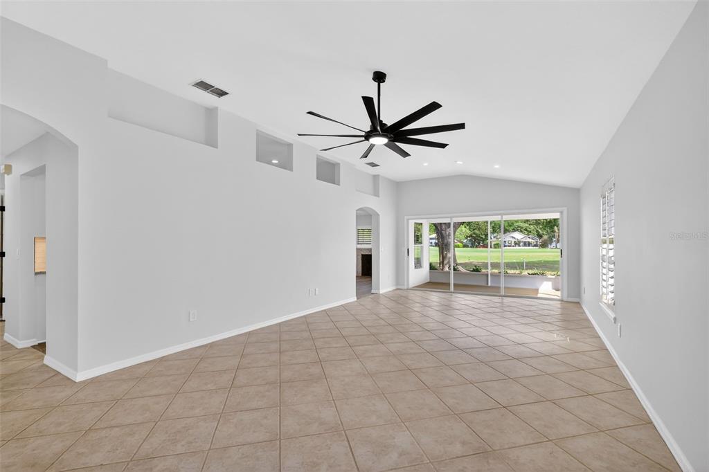6027 Spring Creek Court Mount Dora, FL 32757 - Photo 4 of 42 a view of a livingroom with a ceiling fan and window