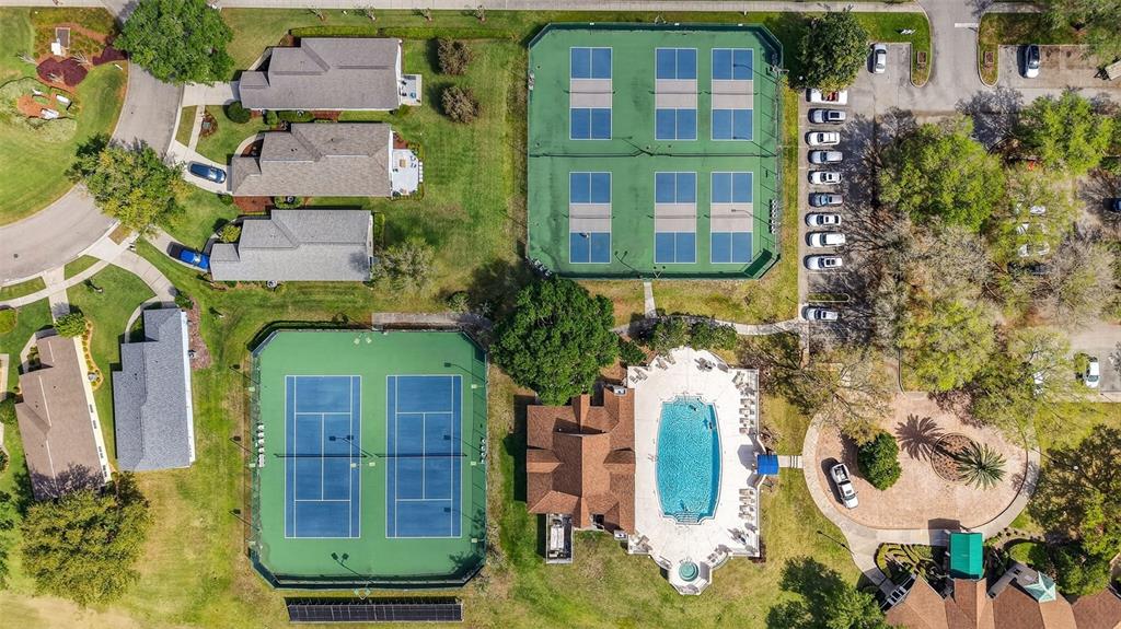 6027 Spring Creek Court Mount Dora, FL 32757 - Photo 42 of 42 an aerial view of a residential apartment building with a yard