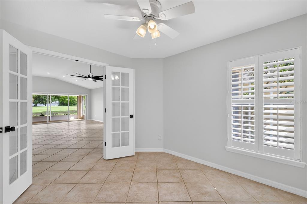 6027 Spring Creek Court Mount Dora, FL 32757 - Photo 7 of 42 a view of a livingroom with a ceiling fan and window