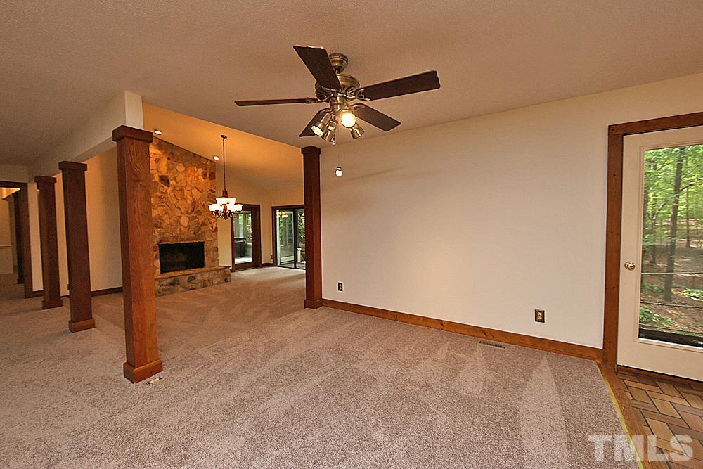 10205 Roadstead Way West Raleigh, NC 27613 - Photo 22 of 22 a view of an empty room with a fireplace
