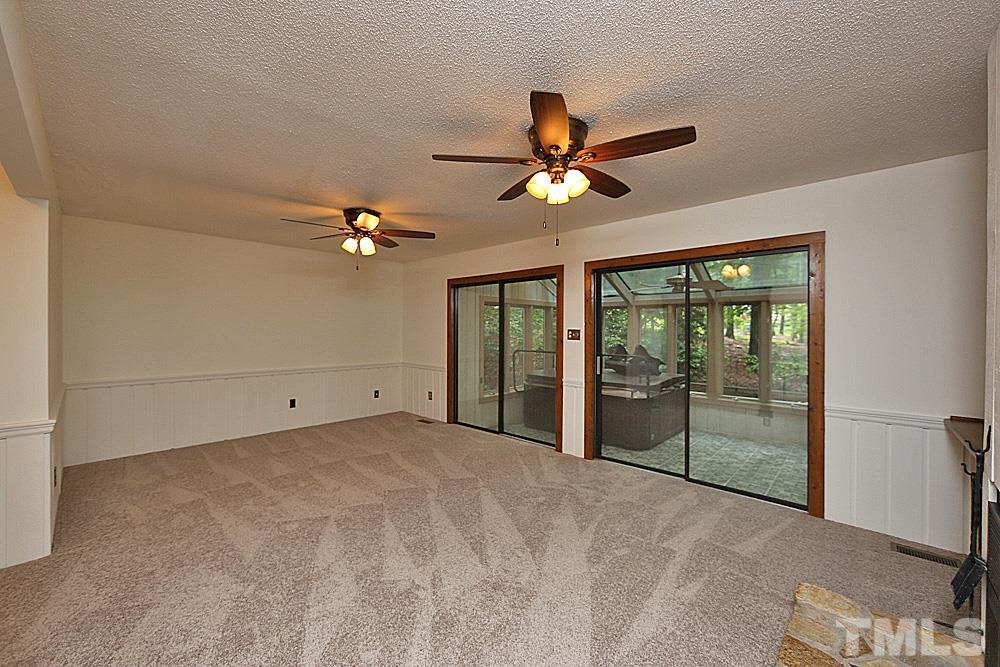10205 Roadstead Way West Raleigh, NC 27613 - Photo 8 of 22 a view of a livingroom with a ceiling fan and window