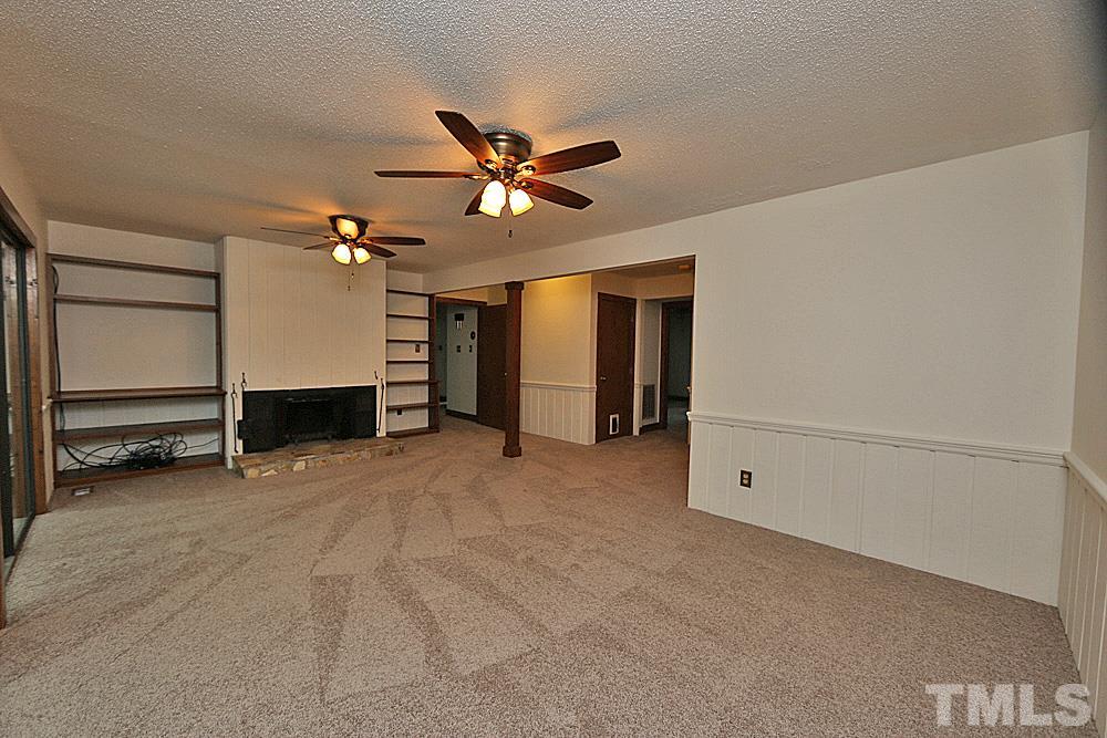 10205 Roadstead Way West Raleigh, NC 27613 - Photo 9 of 22 a view of an empty room with a ceiling fan