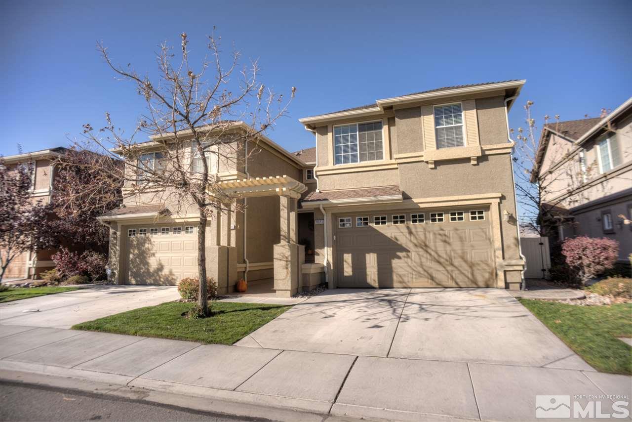 11013 Lamour Lane Reno, NV 89521 - Photo 1 of 1 a front view of a house with a yard and trees