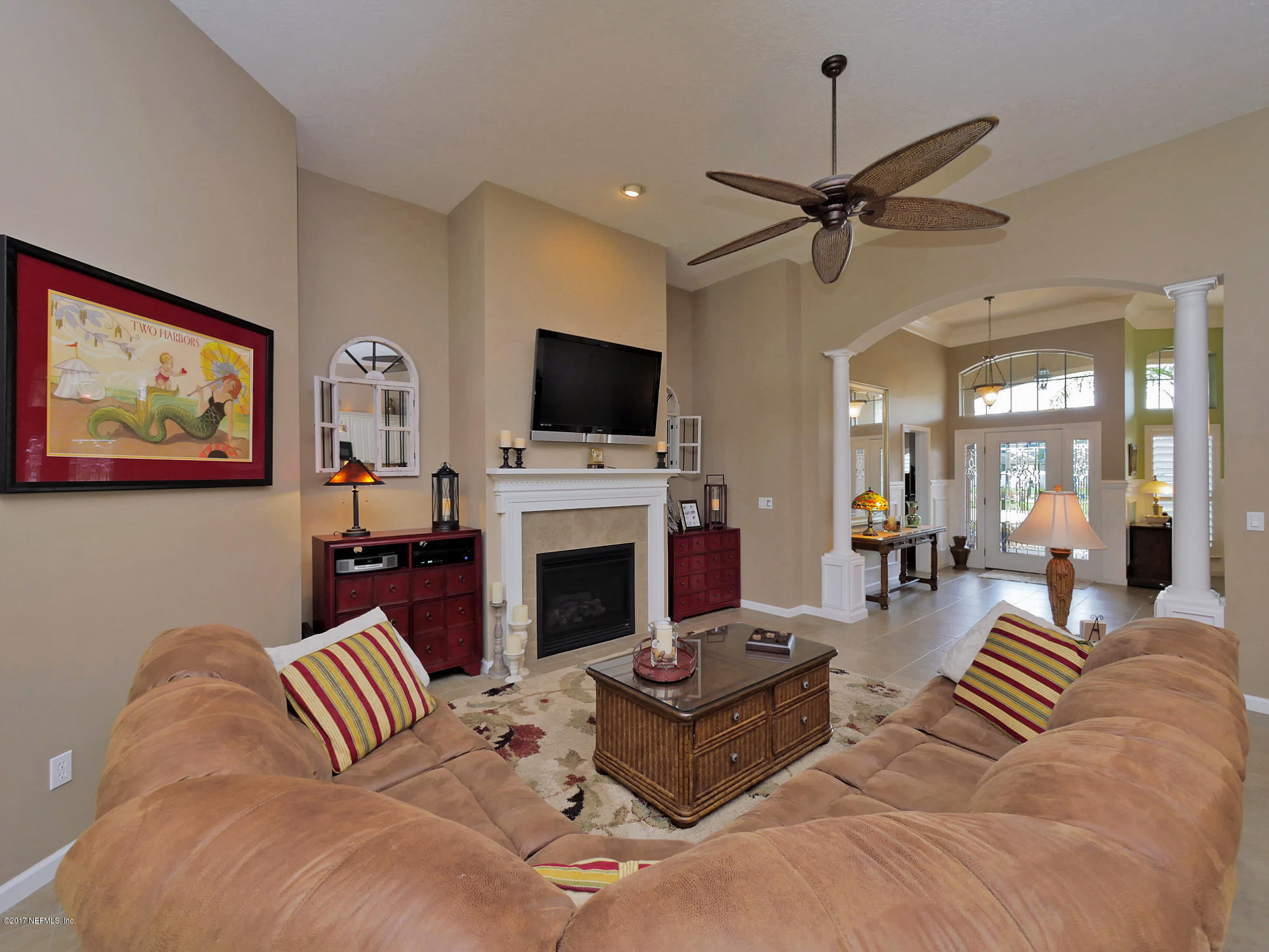888 Reflection Cove Road East Jacksonville, FL 32218 - Photo 6 of 51 06 family room back to the foyer