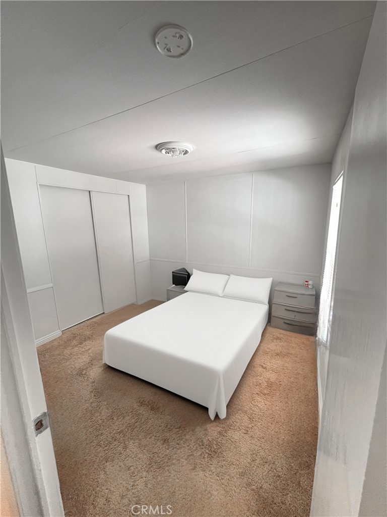 1010 Terrace Road, Unit 38 San Bernardino, CA 92410 - Photo 12 of 16 a large white bed in a white room